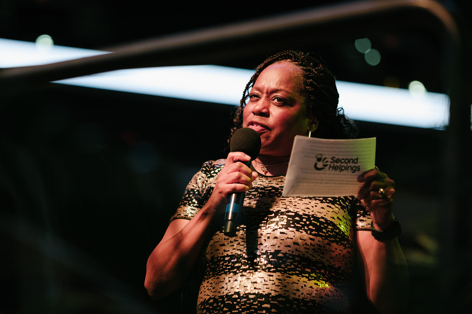 Woman giving a speech on stage