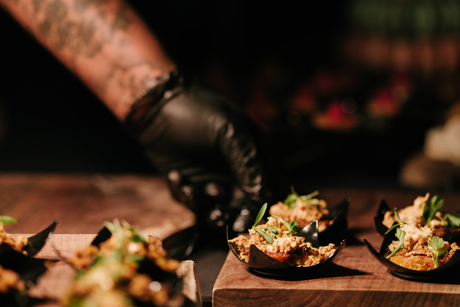 hand placing a food sample onto a table